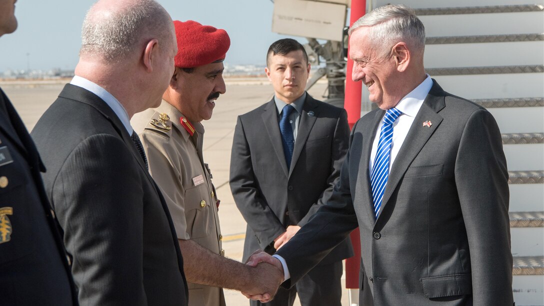 Defense Secretary James N. Mattis shakes hands with a person from the Omani defense ministry.