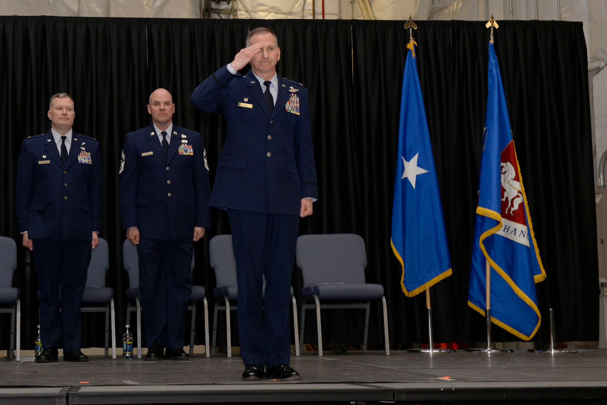 Col. James P. Ryan, commander 157th Air Refueling Wing, renders a final salute to the Airmen of the 157th during a change of command ceremony at Pease Air National Guard Base, N.H., March 10, 2018. Col. John W. Pogorek assumed command of the 157th ARW during this ceremony.(N.H. Air National Guard photo by Senior Airman Taylor Queen)