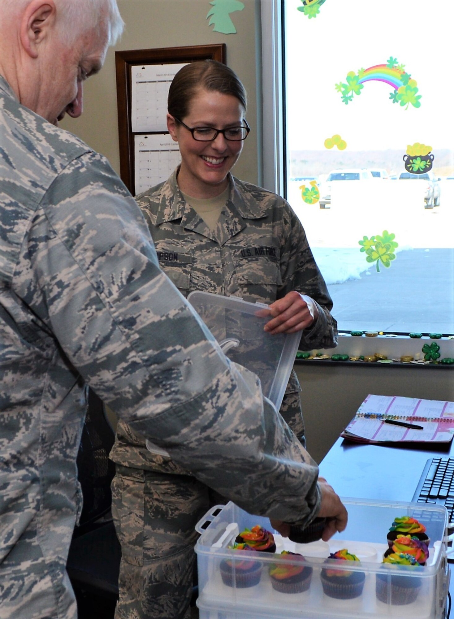 t. Gen. L. Scott Rice, director of the Air National Guard, takes a cupcake offered to him by Tech. Sgt. Jeny Thompson, 111th Operations Group weather forecaster, Horsham Air Guard Station, Pa. March 11, 2018. Rice and his team visited the 111th OG along with five other units during their visit to the 111th Attack Wing (U.S. Air National Guard photo by Tech. Sgt. Andria Allmond)