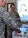 t. Gen. L. Scott Rice, director of the Air National Guard, takes a cupcake offered to him by Tech. Sgt. Jeny Thompson, 111th Operations Group weather forecaster, Horsham Air Guard Station, Pa. March 11, 2018. Rice and his team visited the 111th OG along with five other units during their visit to the 111th Attack Wing (U.S. Air National Guard photo by Tech. Sgt. Andria Allmond)