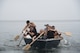 A U.S. Navy team participates in a regatta competition during the first Team Misawa Resilient Relationships and Appreciation Day at Misawa Air Base, Japan, Aug. 18, 2017. Teams worked together, crafting their own boats to race during an obstacle course. The 35th Fighter Wing Chapel Corps coordinated the event as a morale booster testing their pillars of Comprehensive Airman Fitness—mental, physical, social and spiritual—which promoted a sense of community and equip personnel to perform optimally. (U.S. Air Force photo by Senior Airman Sadie Colbert)
