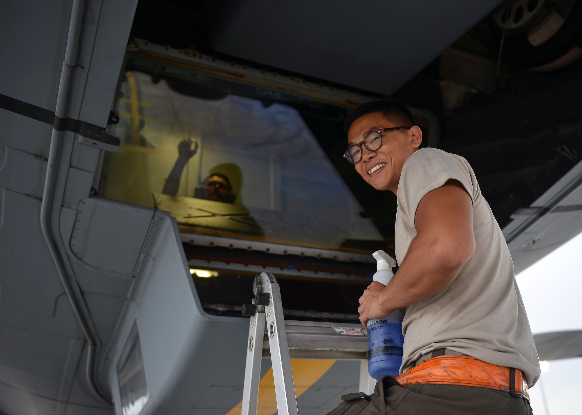 U.S. Air Force Senior Airman Franklin Kaunang, KC-10 crew chief, cleans the window of a KC-10 Extender assigned to the 380th Air Expeditionary Wing, Al Dhafra Air Base, United Arab Emirates, March 2, 2018. The 380th generates multiple aircraft types providing combat missions in joint and combined aerospace operations with Army, Navy, Marine Corps & Coalition forces. (U.S. Air Force photo by Tech. Sgt. Anthony Nelson Jr.)