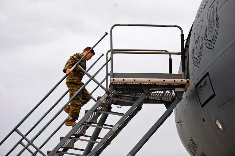 U.S. Air Force Senior Airman Jadon Sylvester, flight engineer, prepares to board a KC-10 Extender after conducting pre-flight checks on March 2, 2018 at the 380th Air Expeditionary Wing, Al Dhafra Air Base, United Arab Emirates.
 The KC-10 can refuel a wide variety of U.S. and allied military aircraft within the same mission.

 (U.S. Air Force photo by Tech. Sgt. Anthony Nelson Jr.)