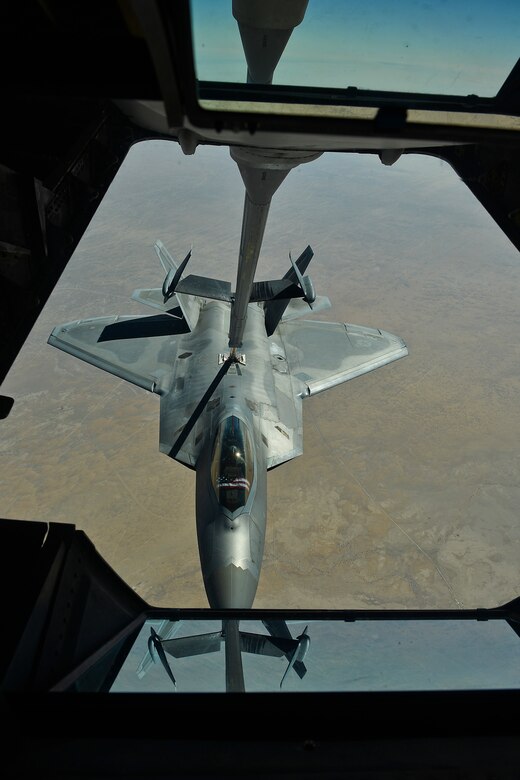 A U.S. Air Force F-22 assigned to the 380th Air Expeditionary Wing, Al Dhafra Air Base, United Arab Emirates receives fuel over Iraq from a KC-10 Extender, March 2,2018.
 The F-22 is a component of the Global Strike Task Force, supporting U.S. and Coalition forces working to liberate territory and people under the control of ISIS.
 (U.S. Air Force photo by Tech. Sgt. Anthony Nelson Jr.)