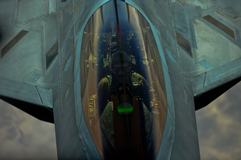 A U.S. Air Force F-22 assigned to the 380th Air Expeditionary Wing, Al Dhafra Air Base, United Arab Emirates prepares to receive fuel from a KC-10 Extender over Syria March 2, 2018. The F-22 possesses a sophisticated sensor suite allowing the pilot to track, identify, shoot and kill air-to-air threats before being detected. 
 (U.S. Air Force photo by Tech. Sgt. Anthony Nelson Jr.)