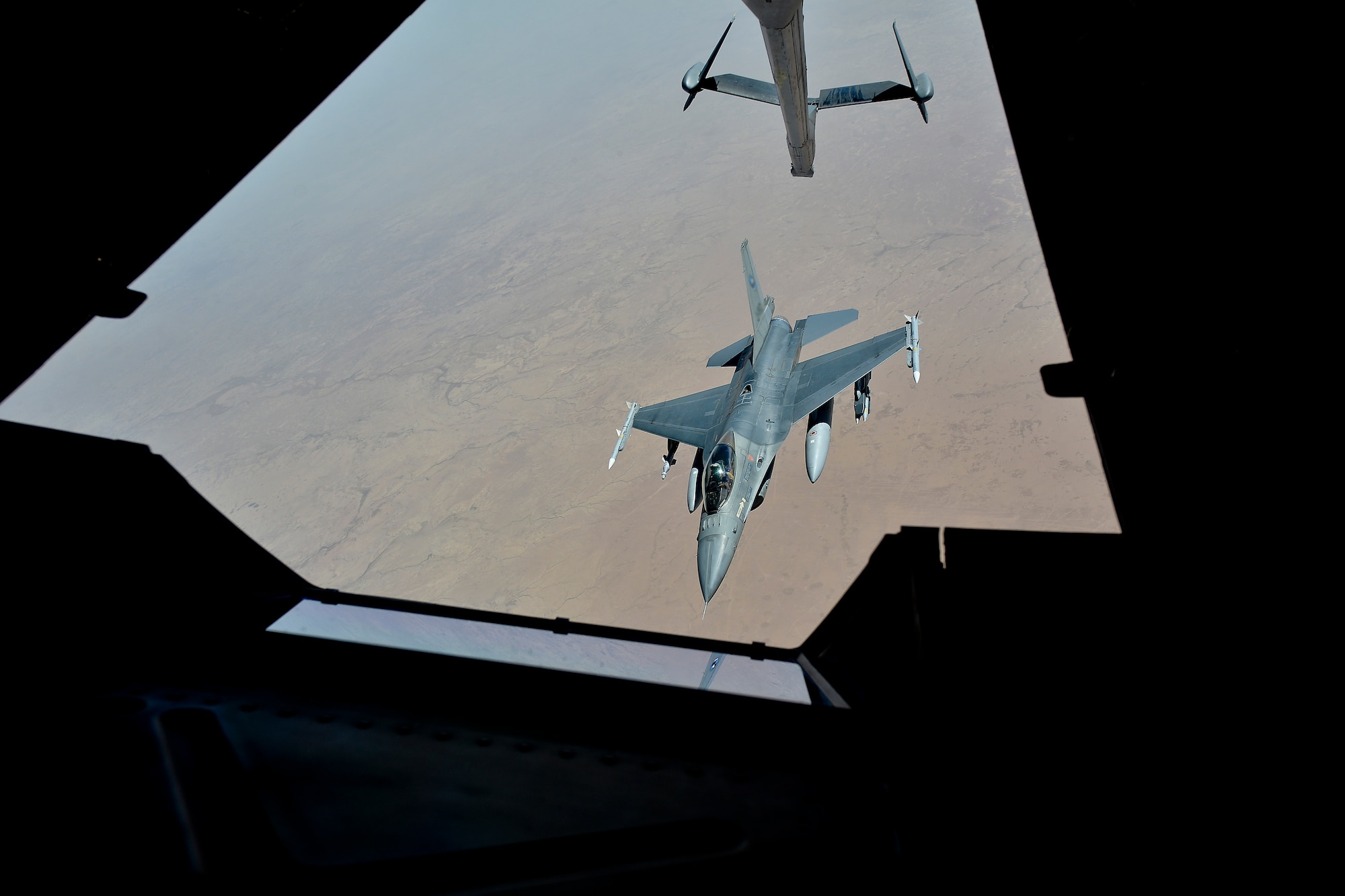 A coalition aircraft detaches from an U.S. KC-10 after receiving fuel over Syria in support of Operation Inherent Resolve March 2, 2018. The KC-10 can refuel a wide variety of U.S. and allied military aircraft within the same mission. 

 (U.S. Air Force photo by Tech. Sgt. Anthony Nelson Jr.)
 (This image was manipulated using blurring techniques .)