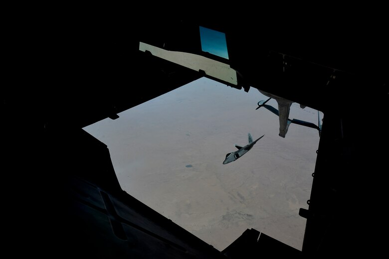 A U.S. Air Force F-22 assigned to the 380th Air Expeditionary Wing, Al Dhafra Air Base, United Arab Emirates disconnects from a KC-10 Extender after receiving fuel over Syria March 2,2018.The F-22s provide close air support and precision guided strikes in an effort to weaken and destroy ISIS operations in the Middle East and around the world.
 (U.S. Air Force photo by Tech. Sgt. Anthony Nelson Jr.)