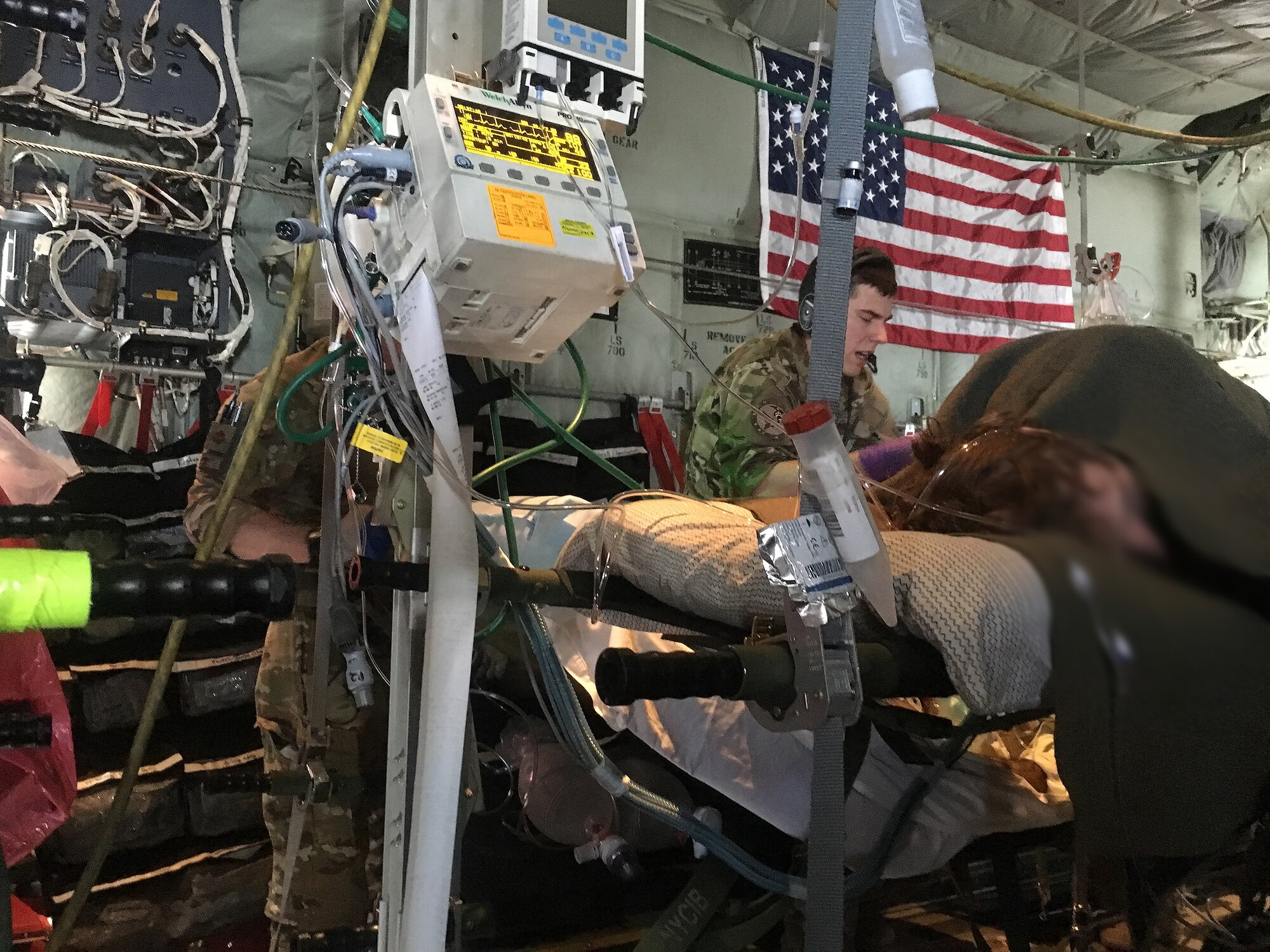 Aeromedical Evacuation members from the 455th Expeditionary Aeromedical Evacuation Squadron monitor patients during a mission in late February.