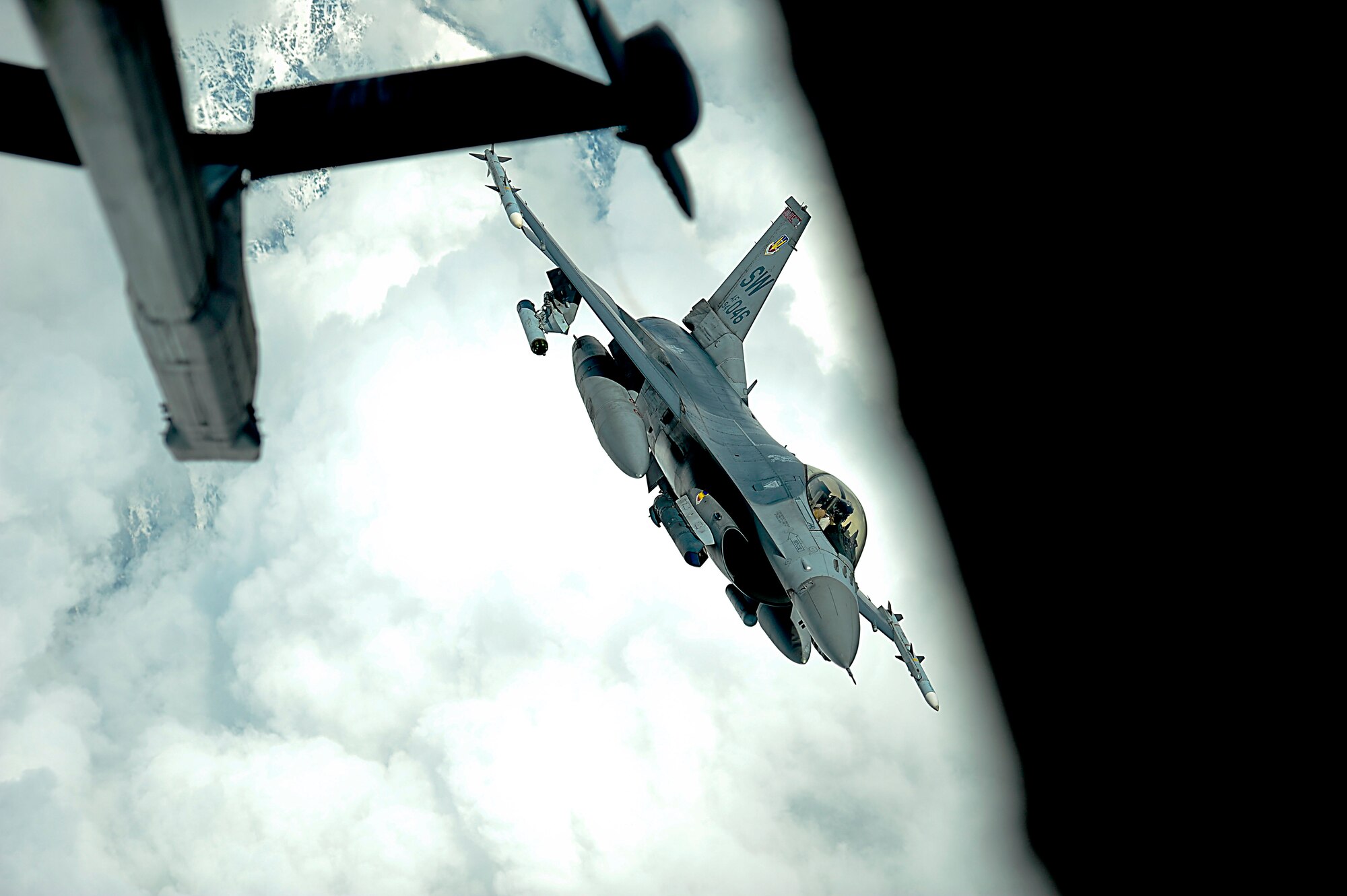 A U.S. Air Force F-16 Fighting Falcon assigned to the 455th Air Expeditionary Wing, Bagram Airfield, Afghanistan receives fuel over Afghanistan from a KC-10 Extender, March 9,2018.
 The F-16's provide cover from above for Afghan and coalition forces on the ground, deterring insurgent activity. The F-16 can fly more than 500 miles, deliver its weapons with superior accuracy and defend itself against enemy aircraft.
 (U.S. Air Force photo by Tech. Sgt. Anthony Nelson Jr.)