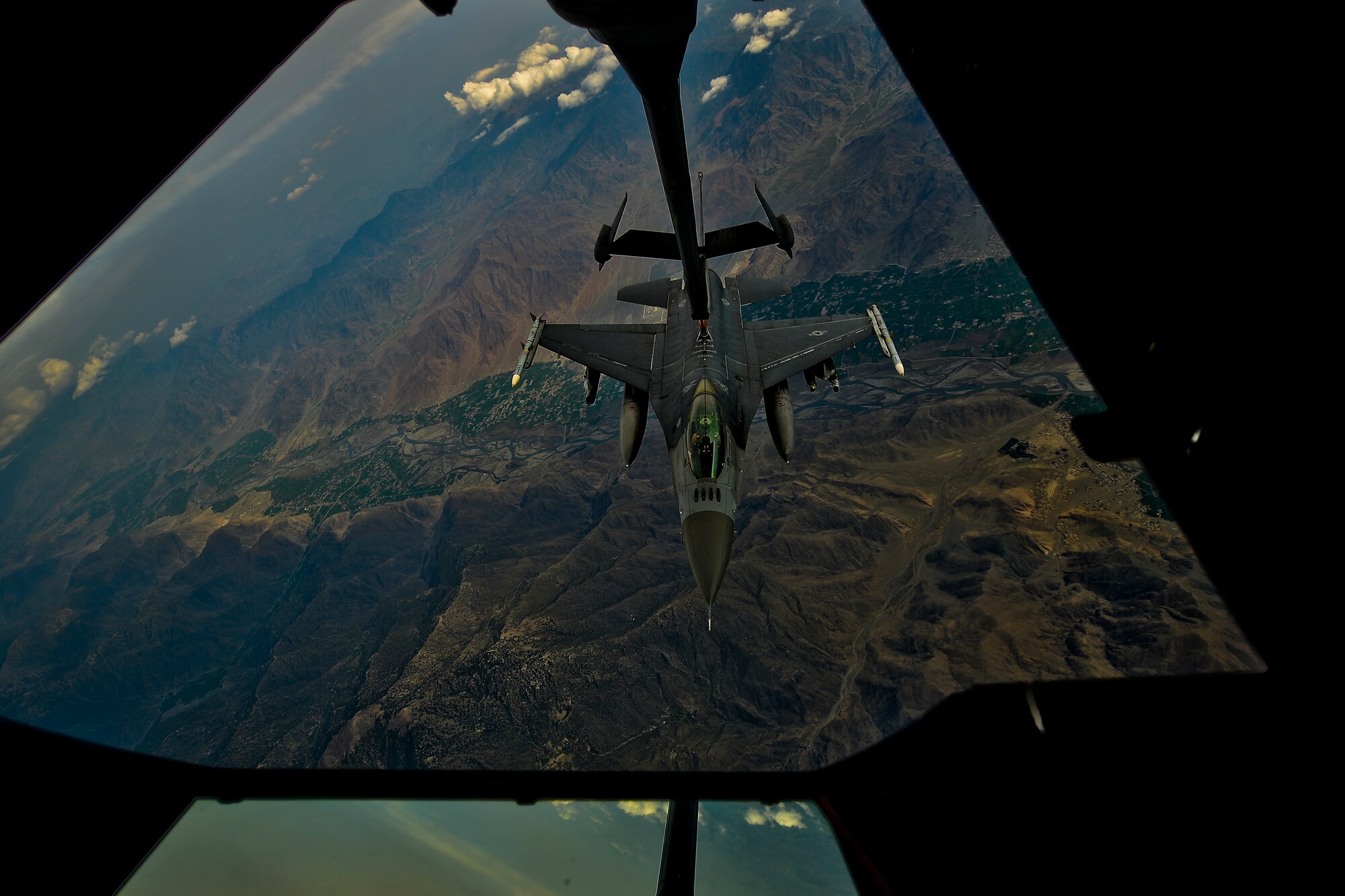 A U.S. Air Force F-16 Fighting Falcon assigned to the 455th Air Expeditionary Wing, Bagram Airfield, Afghanistan receives fuel over Afghanistan from a KC-10 Extender, March 9, 2018.
 The F-16 is part of the Air component arsenal for the U.S. Air Force Central Command providing integrated air defense and deterrent capabilities in the region. 
 (U.S. Air Force photo by Tech. Sgt. Anthony Nelson Jr.)