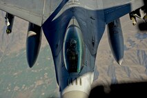 A U.S. Air Force F-16 Fighting Falcon pilot assigned to the 455th Air Expeditionary Wing, Bagram Airfield, Afghanistan approaches a U.S. 
 K.C. 10 Extender over Afghanistan, March 9, 2018.
 The 455th AEW is the premier counter terrorism wing that enables a successful Train, Advise, and Assist campaign. 
 (U.S. Air Force photo by Tech. Sgt. Anthony Nelson Jr.)