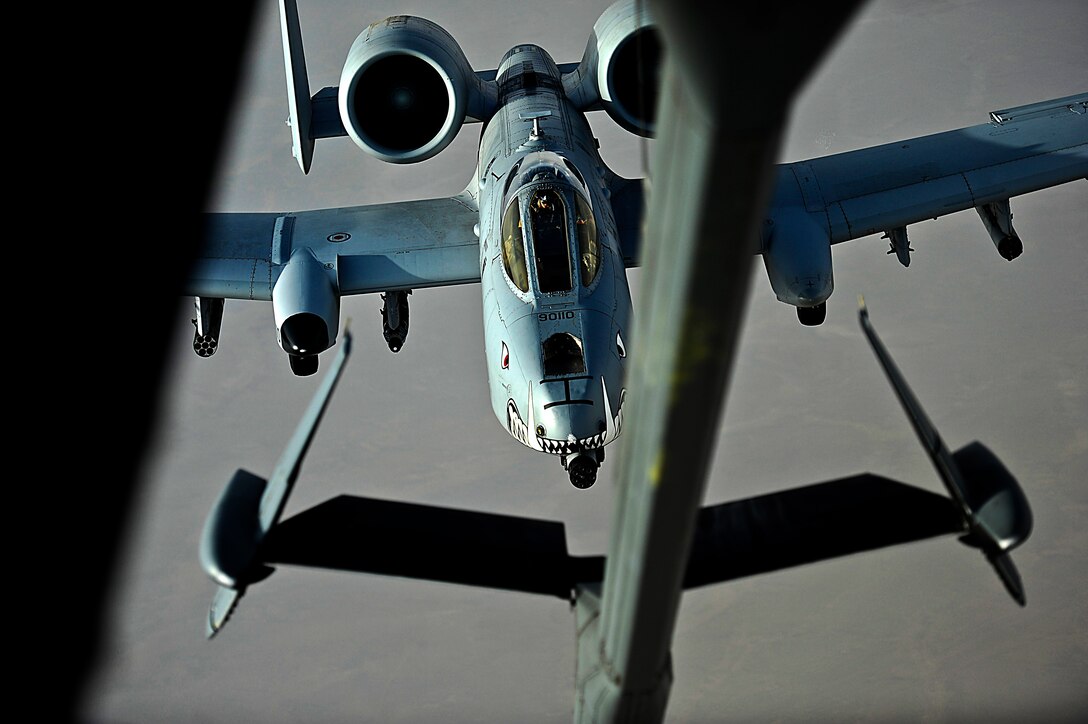 A U.S. Air Force A-10 Thunderbolt II assigned to the Kandahar Airfield, Afghanistan prepares to receive fuel over Afghanistan from a KC-10 Extender, March 9, 2018. The Thunderbolt is the only aircraft specifically designed for Close Air support, Combat Search and Rescue, and Forward Air Controller Airborne missions. 
 (U.S. Air Force photo by Tech. Sgt. Anthony Nelson Jr.)