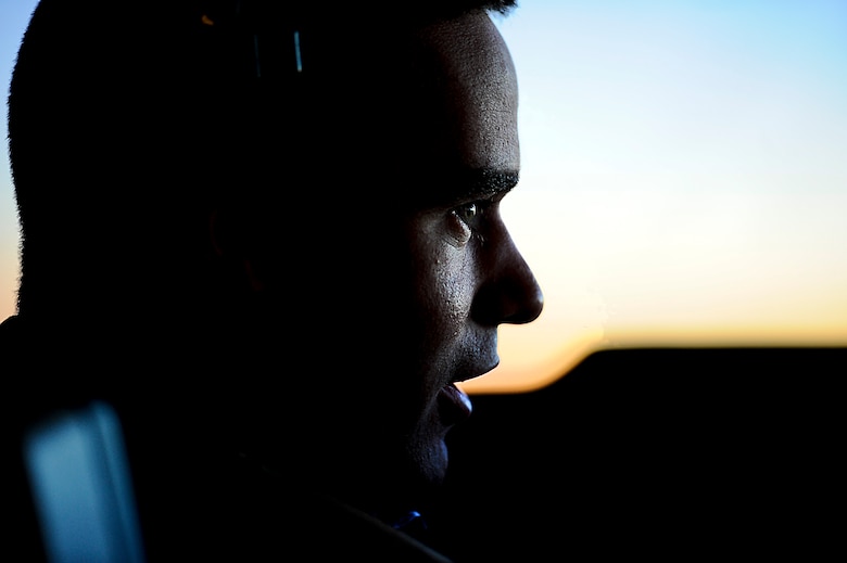 U.S. Air Force KC-10 pilot 1st Lt. Daniel Sherman speaks with Maj. Dylan Peralta Aircraft Commander during a refueling mission over Afghanistan, March 9,2018.
 Sherman and Peralta are deployed from Travis Air Force Base, California. 
 (U.S. Air Force photo by Tech. Sgt. Anthony Nelson Jr.)