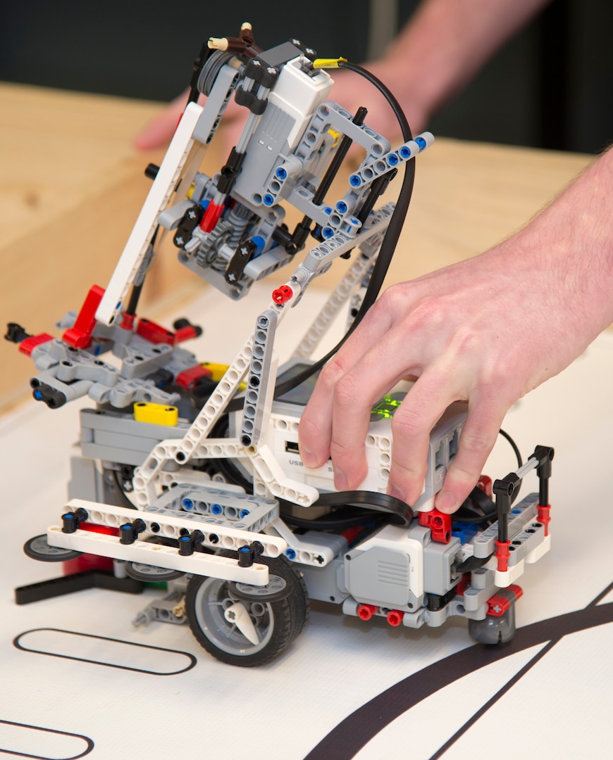 Members of the Cole High School robotics team demonstrate how the Lego brand robot they use in robotics competition works. The Cole team of Henry Yowell, Mitchell Hafer and Aydin Chewning took first place at the Texas Computer Educators Association, or TCEA, robotics area contest in January. As a result of their first-place showing, the team will compete in the TCEA State Robotics Challenge Contest April 7 at Hutto High School, near Austin.