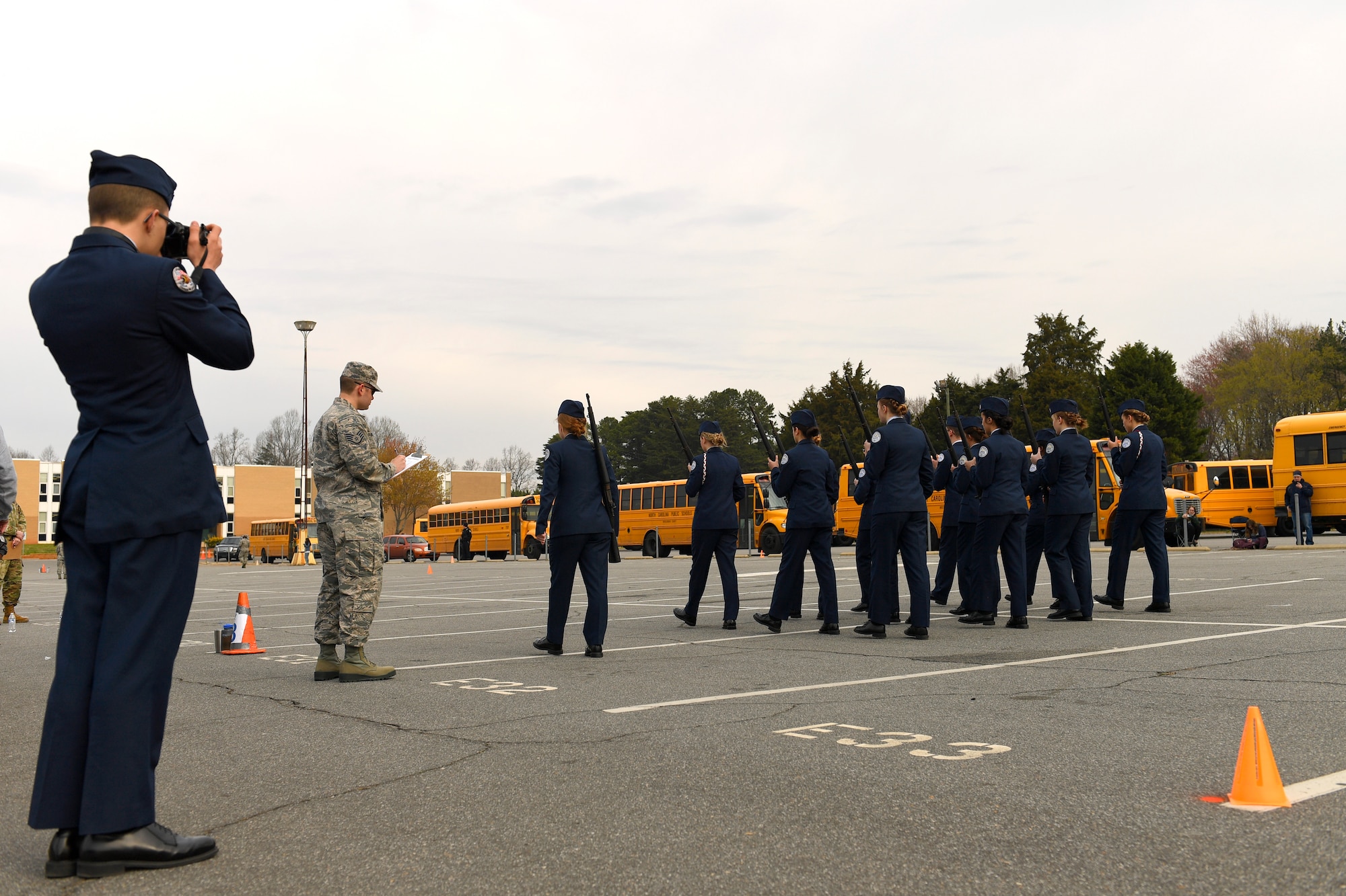 U.S Air Force Staff Sgt. Alexander Duncan, 145th Maintenance Squadron, grades Parkwood High School Air Force Junior Reserve Officers' Training Corps members on armed flight drill during the Patriot Classic Drill Competition held at Independence Hight School, Charlotte, N.C., March 10, 2018. Over 300 students from 14 high schools traveled from as far as 3 hours away to compete and were judged by volunteers from the North Carolina Air and Army National Guard.