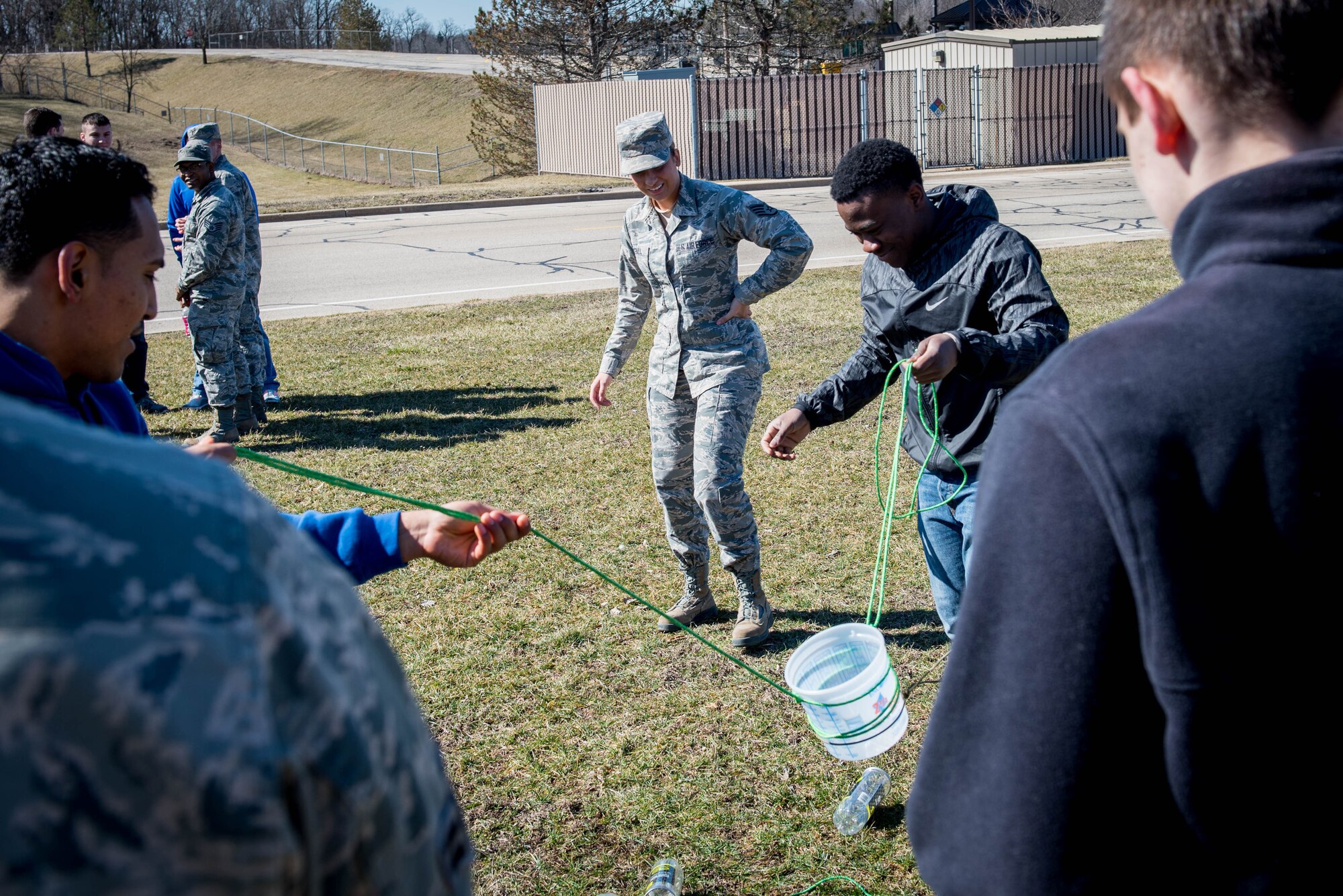 Sergeant McFall participating in teambuilding exercise with Student Flight trainees.