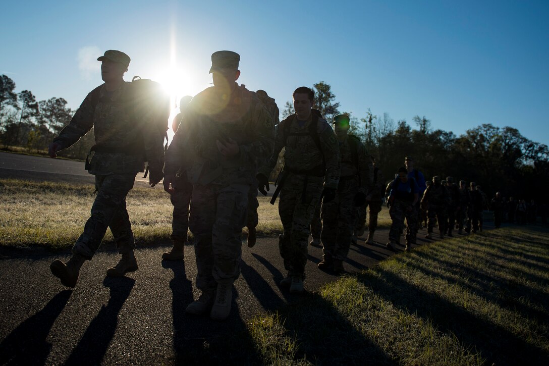 Airmen from the 347th Operations Support Squadron (OSS) participate in a ruck march during a Comprehensive Airman Fitness (CAF) Day, March 9, 2018, at Moody Air Force Base, Ga. During CAF Day, the 347th OSS focused on the physical domain, bolstering resiliency through team building activities. (U.S. Air Force photo by Airman 1st Class Erick Requadt)