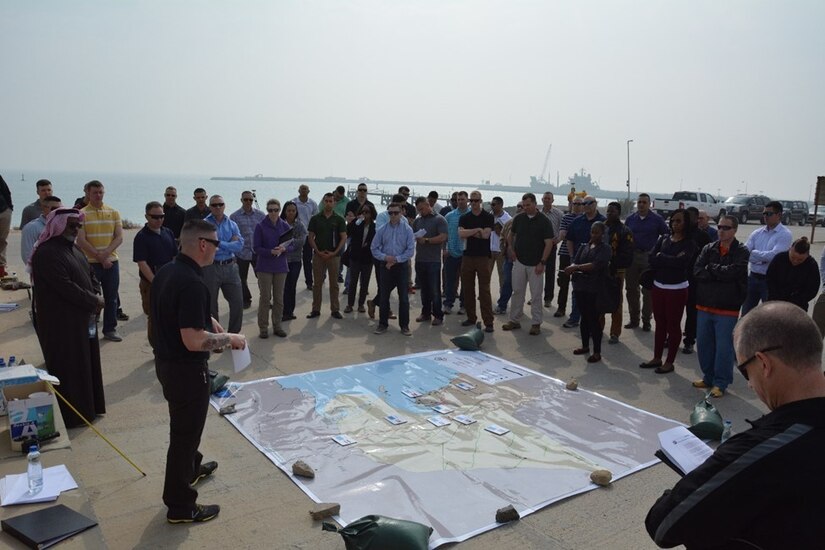 Captain Jeffery Johnson, Directorate of Public Works-South operations officer, leads a discussion at Kuwait Naval Base, Kuwait, March 1, 2018, on how the coalition developed their strategy to defeat the Iraqi military and overcame the hurdles of fighting in new terrain during Operation Desert Storm in 1991.