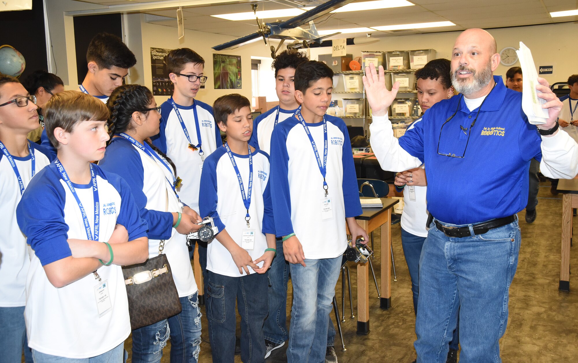 Martin Willis, a technology teacher at Jal Junior High, instructs his students at the Air Force Research Laboratory's La Luz Academy Robotic Challenge Expo March 9 at Kirtland. Willis brought 31 students to the event, that saw more than 100 students representing seven schools compete.