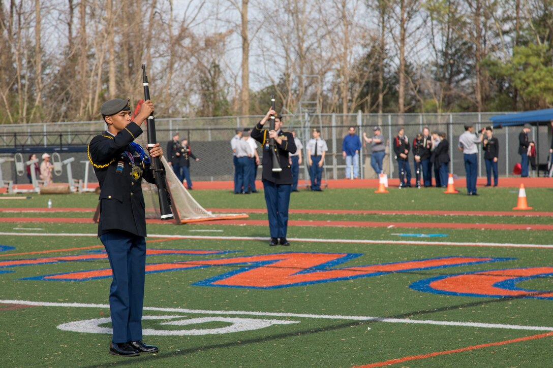 Cadet Christian Wright, a sophomore at Evans High School, Evans, Ga. leads a squad through an armed squad exhibition during the North Springs Charter High School Invitational Drill Meet. Wright's performance earned him first place in the event. U.S. Army Soldiers from the 335th Signal Command (Theater), and Georgia Recruiting Battalion, U.S. Army Recruiting Command served as judges and mentors for  Georgia area Junior Reserve Officer Training Corps (JROTC) students from 13 high schools at the North Springs Charter High School Invitational Drill Meet held in Atlanta, Feb. 24, 2018. (U.S. Army Reserve photo by Capt. David Gasperson)