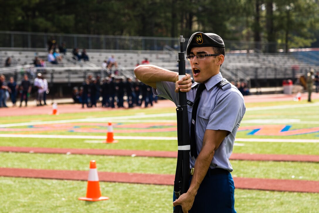 Cadet Justin Collado, a student at Grovetown High School, competes in the individual armed exhibition event the North Springs Charter High School Invitational Drill Meet. Grovetown High School were named overall team champions of the event. U.S. Army Soldiers from the 335th Signal Command (Theater), and Georgia Recruiting Battalion, U.S. Army Recruiting Command served as judges and mentors for  Georgia area Junior Reserve Officer Training Corps (JROTC) students from 13 high schools at the North Springs Charter High School Invitational Drill Meet held in Atlanta, Feb. 24, 2018. (U.S. Army Reserve photo by Capt. David Gasperson)