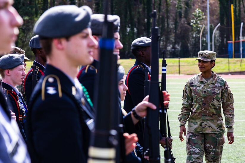 U.S. Army Staff Sgt. Stephina Reyes, a recruiter with Georgia Company, Georgia Recruiting Battalion, U.S. Army Recruiting Command inspects JROTC students during a 'knock em out' drill and ceremony competition. Graders called out commands, and failure to produce the proper movement resulted in ejection from the competition. U.S. Army Soldiers from the 335th Signal Command (Theater), and Georgia Recruiting Battalion, U.S. Army Recruiting Command served as judges and mentors for  Georgia area Junior Reserve Officer Training Corps (JROTC) students from 13 high schools at the North Springs Charter High School Invitational Drill Meet held in Atlanta, Feb. 24, 2018. (U.S. Army Reserve photo by Capt. David Gasperson)