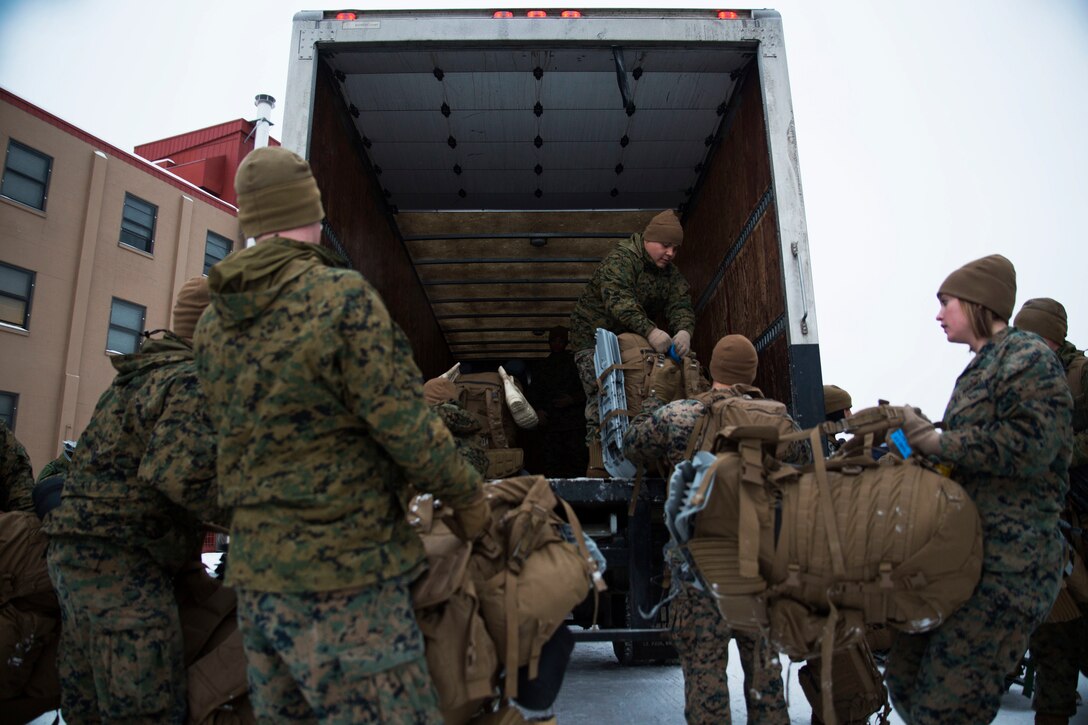 Marines load trucks
