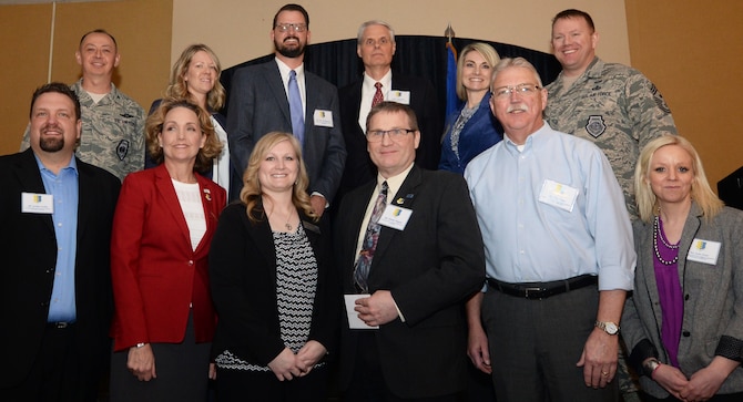 Nine area civic and business leaders were inducted into the Ellsworth Honorary Commanders program during a special event March 8, 2018, at the Dakota’s Club at Ellsworth Air Force Base, S.D. Pictured are (front row): Joshua Farley, Prudential Advisors representative; Marnie Herrmann, Security First Bank senior vice president; Melanie Barclay, Make-A-Wish of South Dakota regional director; Dennis Wagner, Box Elder Chamber of Commerce president; Danny Coon, City of Rapid City Operations Management engineer; Kadee Hande, Central States Fair & Black Hills Stock Show marketing manager; (back row) Col. John Edwards, 28th Bomb Wing commander; Shelley Christianson; Eric Christianson, Black Hills Community Bank financial representative; Craig Pfeifle, Seventh Circuit Court presiding judge; Terree Matson-McCoy, VRC Metal Systems chief operating officer; and Chief Master Sgt. Adam Vizi, 28th BW command chief master sergeant. (U.S. Air Force photo by Airman 1st Class Thomas Karol)