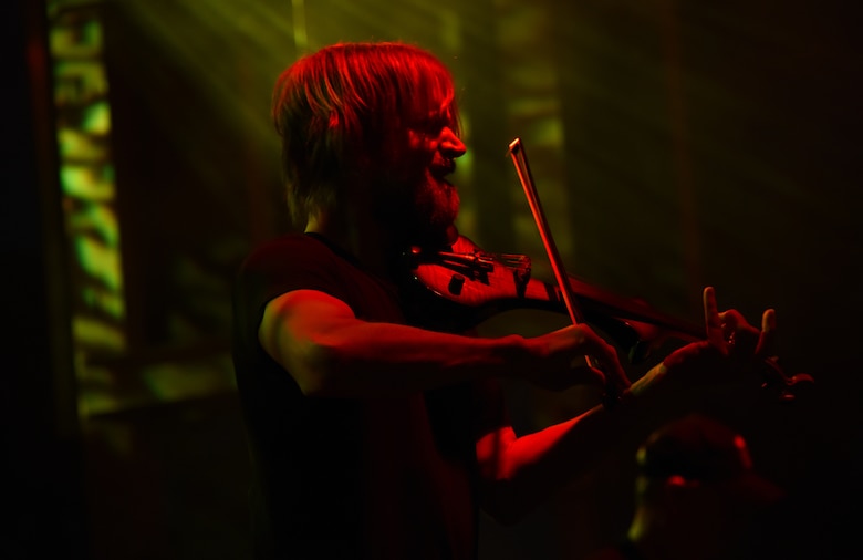 Dan Myers, Lt. Dan Band violinist, plays a violin during a concert at Tyndall Air Force Base, Fla., March 4, 2018. In addition to a violinist, the band also has numerous singers, percussionist and harmonica players (U.S. Air Force photo by Airman 1st Class Solomon Cook/Released)