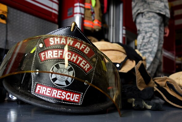 Gear assigned to 20th Civil Engineer Squadron firefighters sits arranged on a garage floor prior to a donning competition at Shaw Air Force Base, S.C., March 8, 2018.