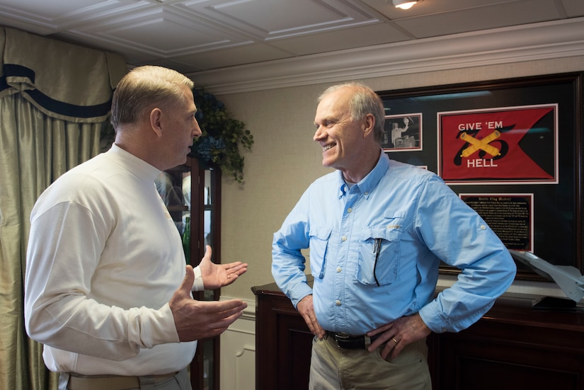 Navy Secretary Richard V. Spencer, right, speaks with Carrier Strike Group 8 Command Master Chief Petty Officer Michael Bates.