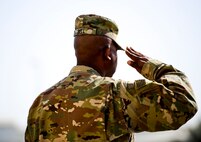 U.S. Army Command Sgt. Maj. Robert Bella, command sergeant major of the 1st Battalion, 7th Air Defense Artillery, renders a final salute to the men and women of 1-7 ADA during the change of responsibility ceremony at Al Dhafra Air Base, United Arab Emirates, March 11, 2018.
 Bell's next assignment will be Command Sergeant Major of the space command unit at Fort Carson, Colorado.

 (U.S. Air Force photo by Tech. Sgt. Anthony Nelson Jr)
