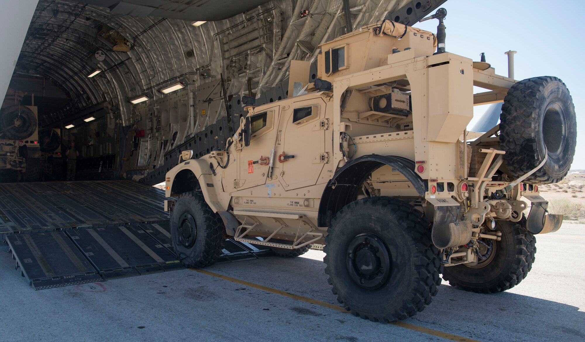 Mine-resistant ambush protected vehicles are loaded onto a C-17 Globemaster III at an undisclosed location in Southwest Asia March 7, 2018.