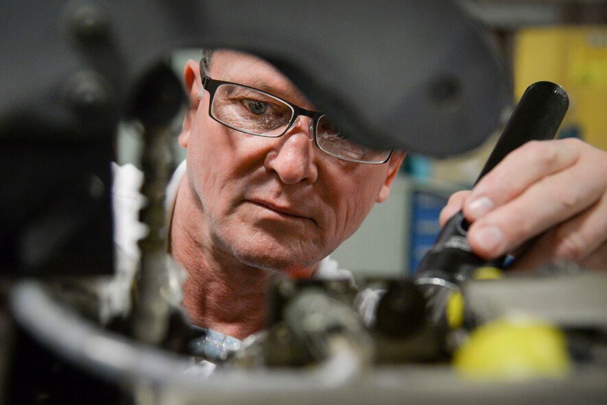 Dave Duggar, 12th Maintenance Group J-85 propulsion shop supervisor, conducts an inspection on a T-38 Talon engine Feb. 28 2018, at Joint Base San Antonio-Randolph, Texas.  Duggar oversees the engine shop and test cell ensuring T-38 engines are "mission ready" to conduct daily sorties for the 12th Flying Training Wing. (U.S. Air Force photo by Sean M. Worrell)