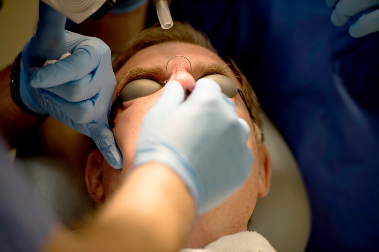 A dermatology patient, receives laser treatment on his nose at MacDill Air Force Base, Fla., March 9, 2018.