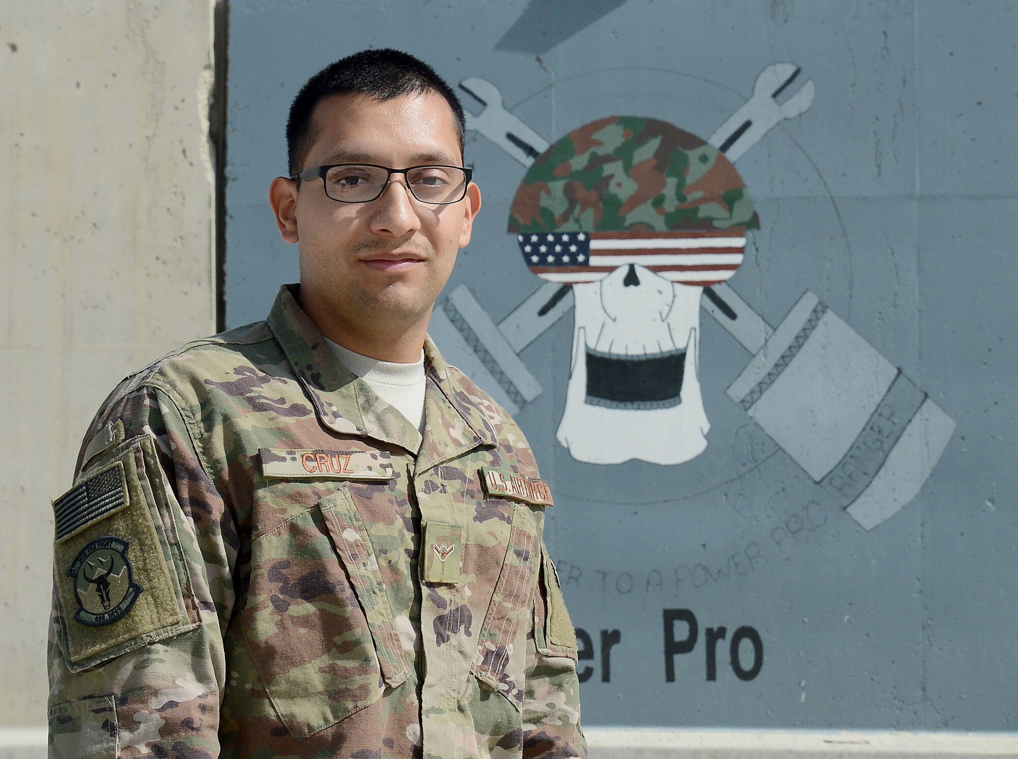 Airman Rene Cruz, 455th Expeditionary Civil Engineer Squadron power production engineer, poses for a photo Mar. 6, 2018 at Bagram Airfield, Afghanistan.
