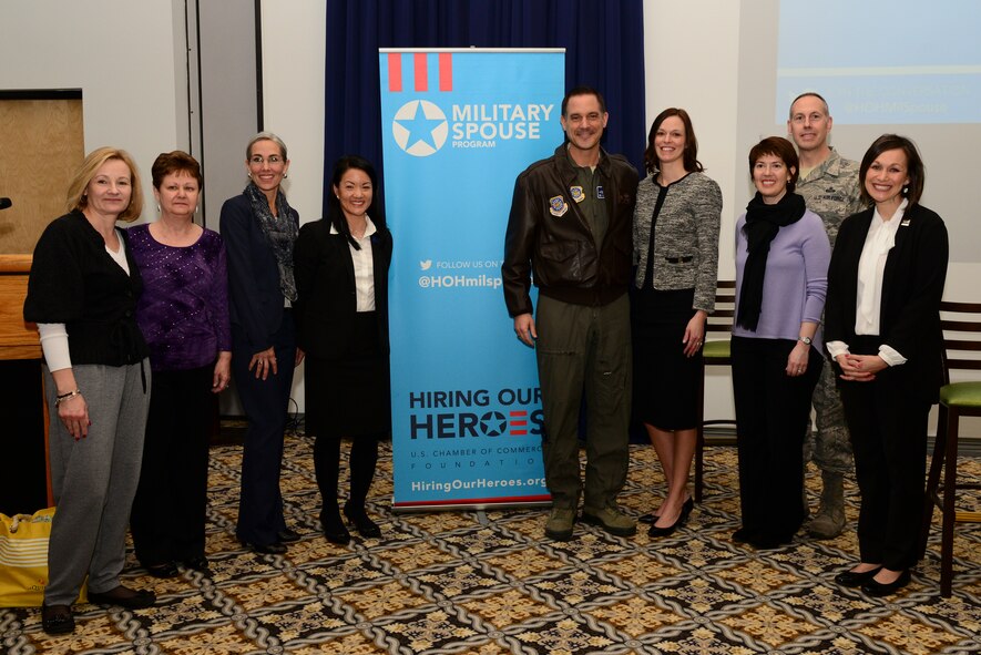 Coordinators of the second annual Spouse Symposium stand for a group photo with Col. Ethan Griffin (center), 436th Airlift Wing commander, his wife, Erin Griffin, and Chief Master Sgt. Michael Zimmerman, 436th AW interim command chief, March 7, 2018, during the second annual Spouse Symposium at Dover Air Force Base, Del. The full-day employment education event included several segments, including salary and compensation negotiation, LinkedIn and social media best practices and a career information fair. (U.S. Air Force photo by Staff Sgt. Aaron J. Jenne)
