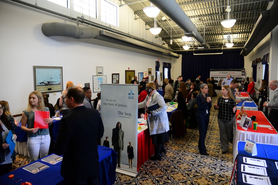 Team Dover Spouses interact with local employers during the career information fair segment of the second annual Spouse Symposium March 7, 2018, at Dover Air Force Base, Del. More than 40 spouses and 20 vendors attended the full-day event. (U.S. Air Force photo by Staff Sgt. Aaron J. Jenne)