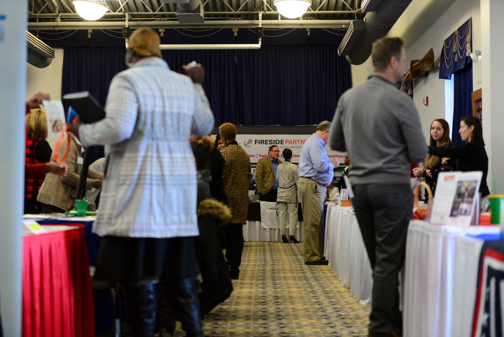Spouses of Airmen assigned to Dover Air Force Base interact with local employers during the career information fair segment of the second annual Spouse Symposium March 7, 2018, at Dover AFB, Del. The purpose of the full-day event was to prepare spouses for the installation’s upcoming Transition Summit slated for April 12. (U.S. Air Force photo by Staff Sgt. Aaron J. Jenne)
