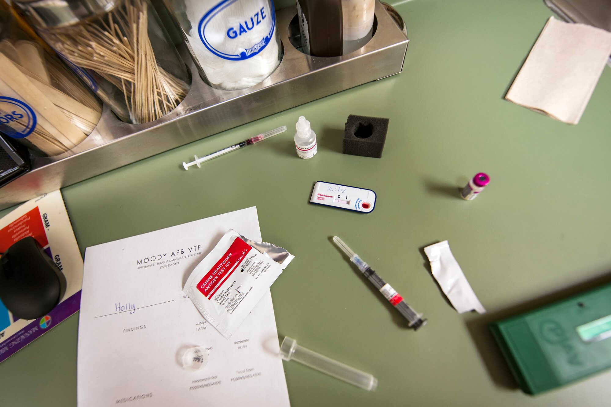 Medical tools and a heartworm test rest on a counter, March 6, 2018, at Moody Air Force Base, Ga. The Veterinarian Clinic provides treatment and care for the Military Working Dogs stationed here while also providing the same care for personally owned animals. (U.S. Air Force photo by Airman Eugene Oliver)