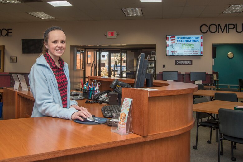 Stephanie Graves, 375th Force Support Squadron library aid, checks for a book's availability Feb. 26, 2018, at Scott Air Force Base, Ill. The Scott Air Force Base Library has been recently remodeled with all new furniture and shelving giving the library a more modern look. (U.S. Air Force photo by Senior Airman Melissa Estevez)