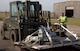 U.S. Air Force Senior Airman Kelvin Mason, 100th Logistics Readiness Squadron traffic management officer, supervises the moving of cargo at RAF Mildenhall, England, March 9, 2018. The cargo was part of a cargo deployment function scheduled to go to Camp Lemonier, Djibouti. (U.S. Air Force photo by Airman 1st Class Benjamin Cooper)