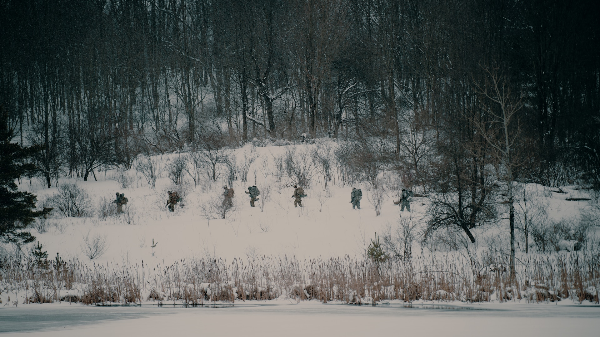 Soldiers assigned to Charlie Troop, 2nd Battalion, 101st Cavalry Regiment, New York Army National Guard, move toward their objectives through more than 20 inches of snow after being inserted by a New York National Guard helicopter.