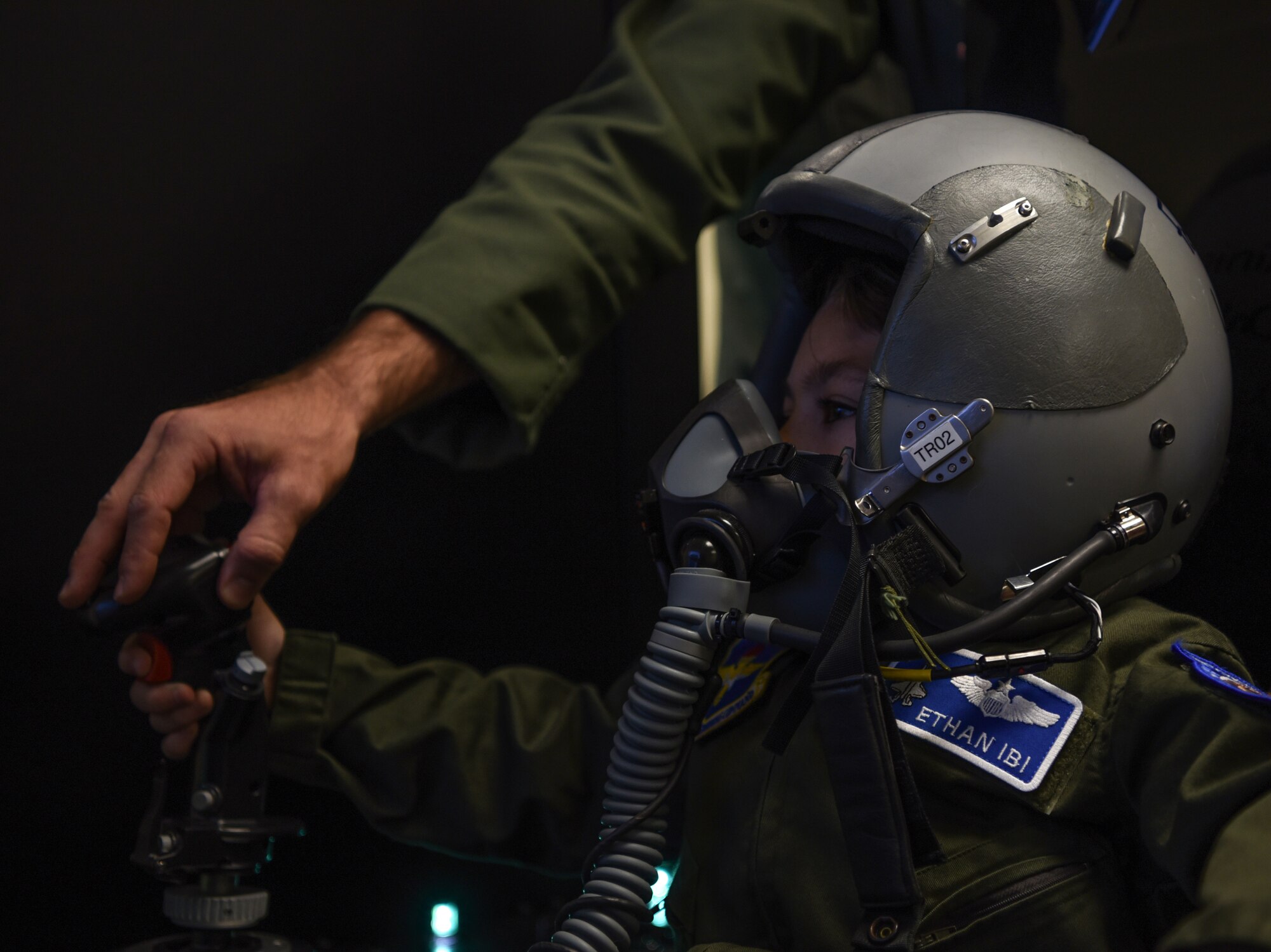 Ethan Ibi, pilot for a day, plays with the pilot flight simulator March 9, 2018, at Eglin Air Force Base, Fla. The 33rd Fighter Wing hosted Ethan Ibi and his family for the "Pilot for a day" program. (U.S. Air Force photo by Airman 1st Class Emily Smallwood)