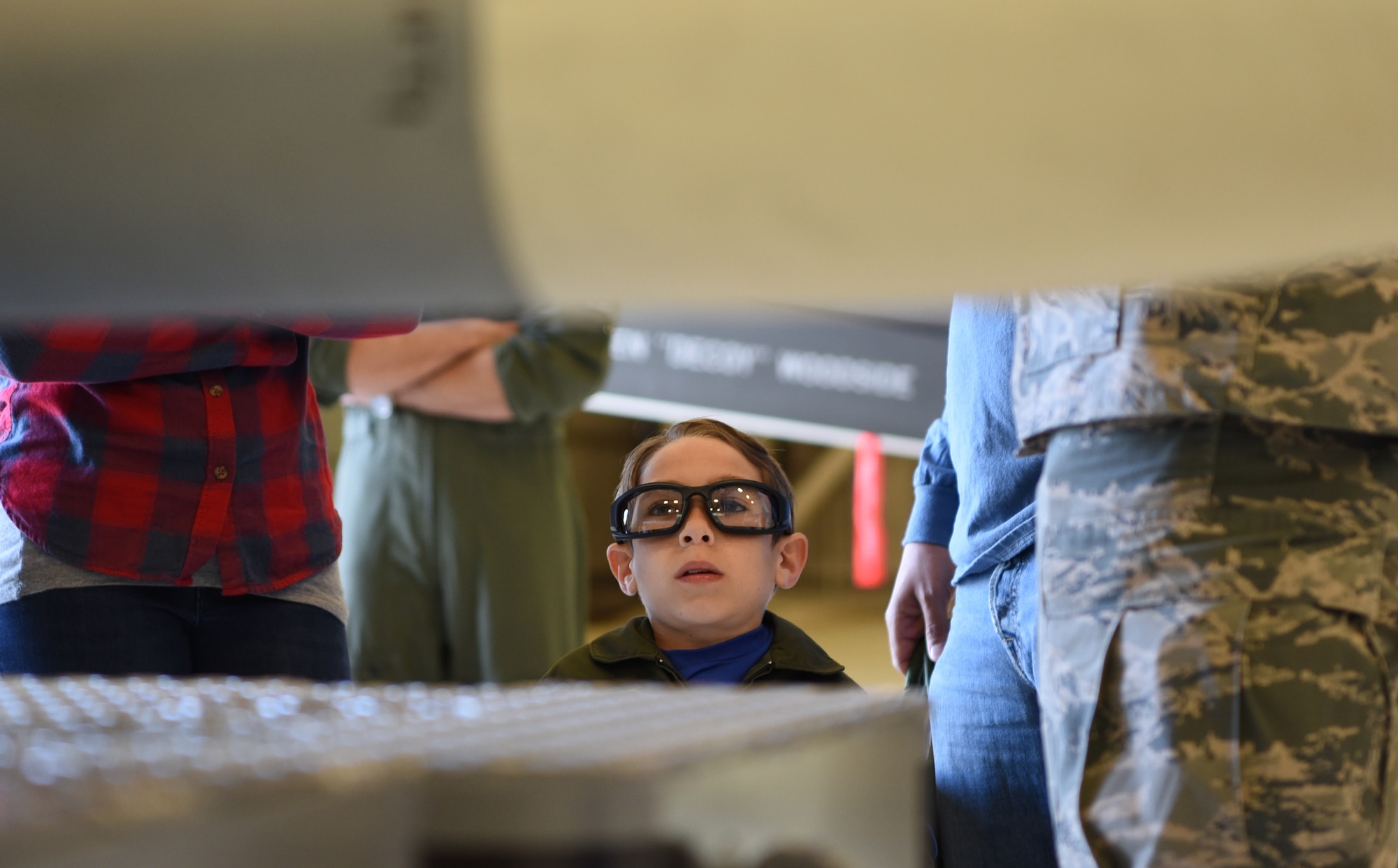 Ethan Ibi, pilot for a day, admires weapons March 9, 2018, at Eglin Air Force Base, Fla. The 33rd Fighter Wing hosted Ethan Ibi and his family for the "Pilot for a day" program. (U.S. Air Force photo by Airman 1st Class Emily Smallwood)