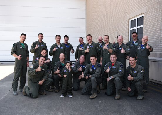 Ethan Ibi, pilot for a day, poses with the 58th Fighter Squadron "Gorillas" pilots March 9, 2018, at Eglin Air Force Base, Fla. The 33rd Fighter Wing hosted Ethan Ibi and his family for the "Pilot for a day" program. (U.S. Air Force photo by Airman 1st Class Emily Smallwood)