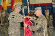 Maj. Gen. Andrew Schafer (left), 28th Infantry Division commanding general, and Command Sgt. Maj. John Jones unfurl the division colors during a transfer of authority ceremony March 8, 2018. The Pennsylvania Army National Guard unit’s headquarters and headquarters battalion assumed responsibility from its counterpart, the 35th Infantry Division which is comprised of soldiers from the Missouri and Kansas National Guard. The 28th’s HHBN will serve as a division headquarters for roughly 10,000 soldiers conducting theater security operations in the Middle East.
