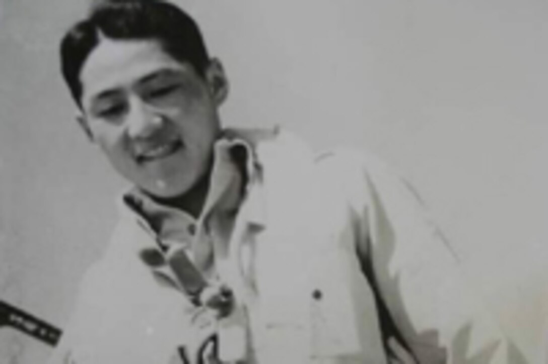 A back and white photo of a Korean-American pilot.