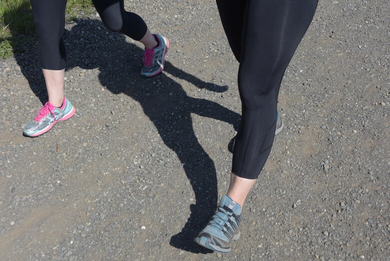 Senior Master Sgt. Jenny Hendry (Left), 60th Aeromedical Squadron, hikes up a hill at Pena Adobe Regional Park in Vacaville, Calif., with her cousin, Tech. Sgt. Nikki Webb (Right), 60th Air Mobility Wing, March 11, 2018. Hendry joined Webb on a 10-mile hike as she prepares for the Bataan Memorial Death March on March 25. (U.S. Air Force photo/Tech. Sgt. James Hodgman)