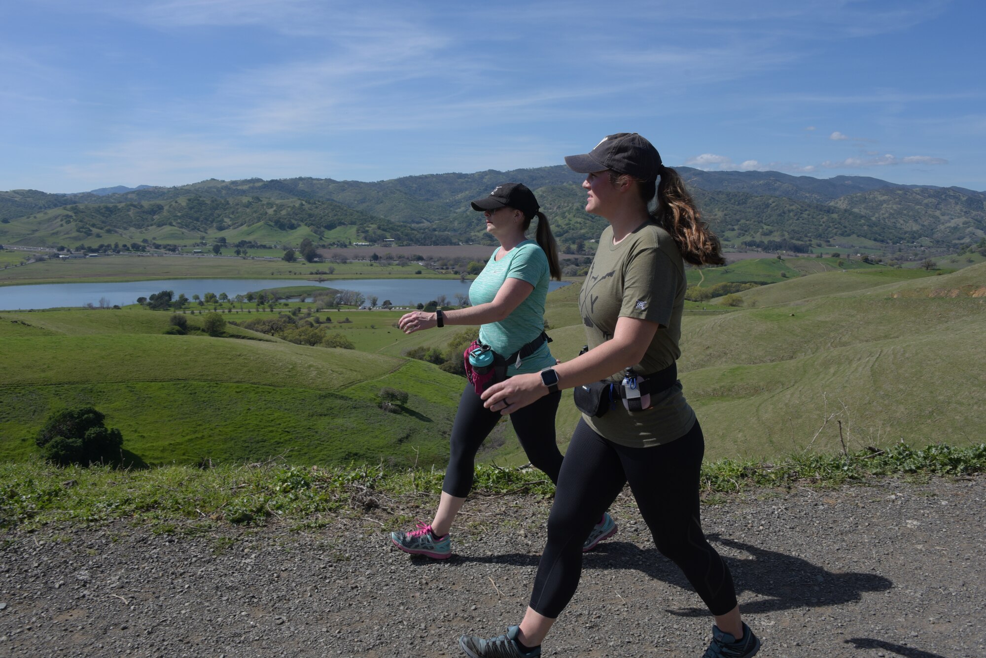 Senior Master Sgt. Jenny Hendry (Left), 60th Aeromedical Squadron, hikes up a hill at Pena Adobe Regional Park in Vacaville, Calif., with her cousin, Tech. Sgt. Nikki Webb, 60th Air Mobility Wing March 11, 2018. Hendry joined Webb on a 10-mile hike as she prepares for the Bataan Memorial Death March on March 25. (U.S. Air Force photo/Tech. Sgt. James Hodgman)